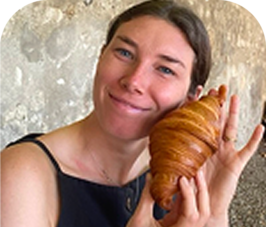 Keaton holding a croissant